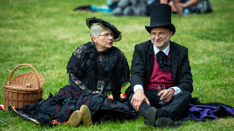 couple in gothic outfit on picnic