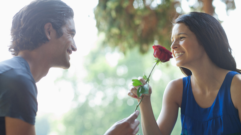 couple holding rose