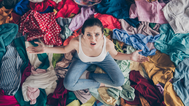 woman in pile of clothes