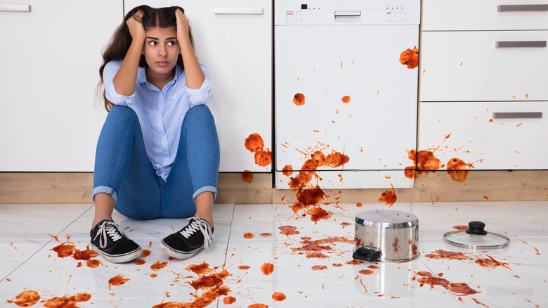 frazzled woman in messy kitchen