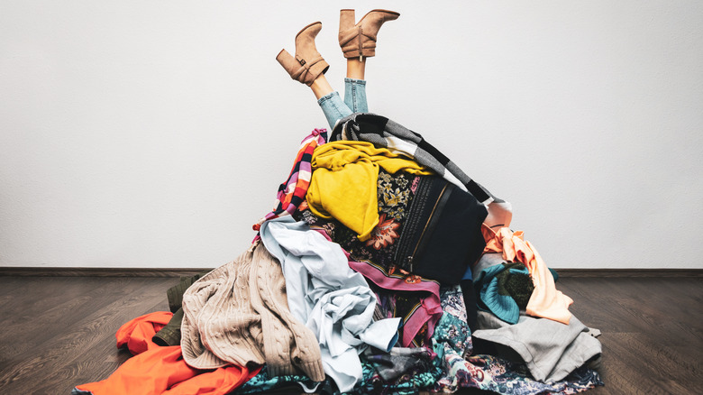 woman in pile of clothes