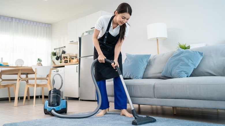 woman vacuuming living room