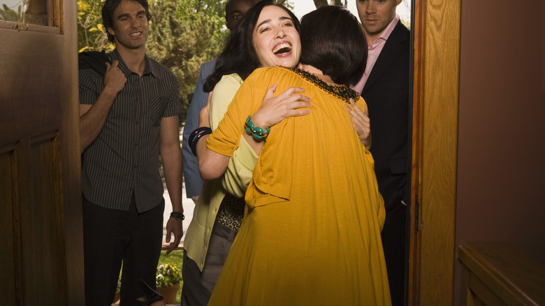 Women hugging yellow dress