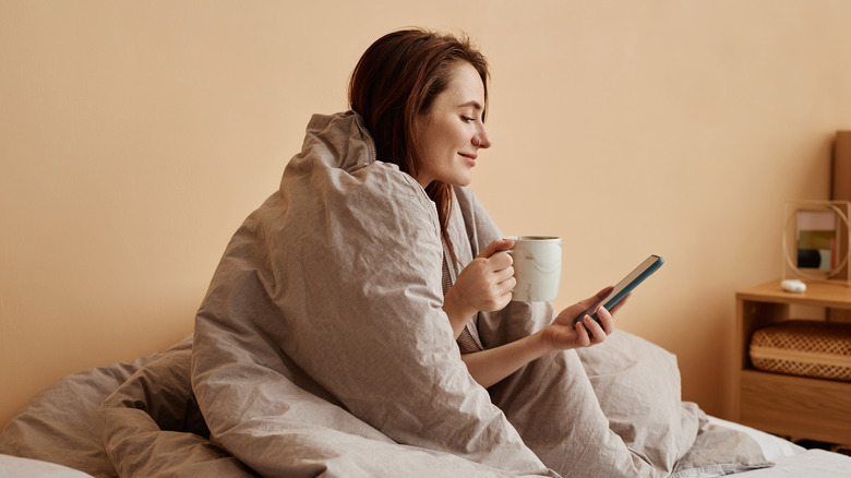 Woman relaxing in bed