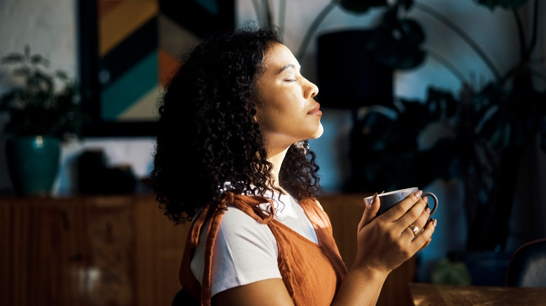 Woman meditating at home