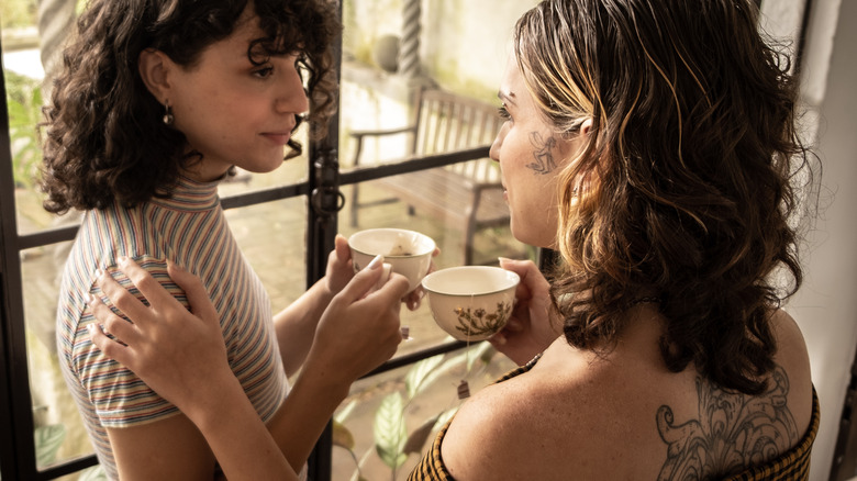 Two friends drinking tea