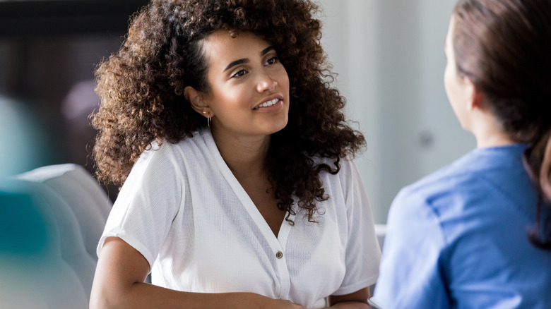 Woman listening to other woman