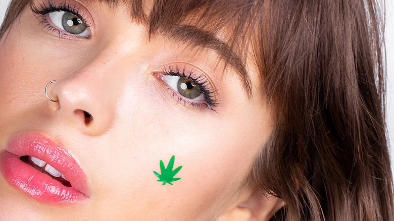 Woman wearing hemp-shaped patch on face