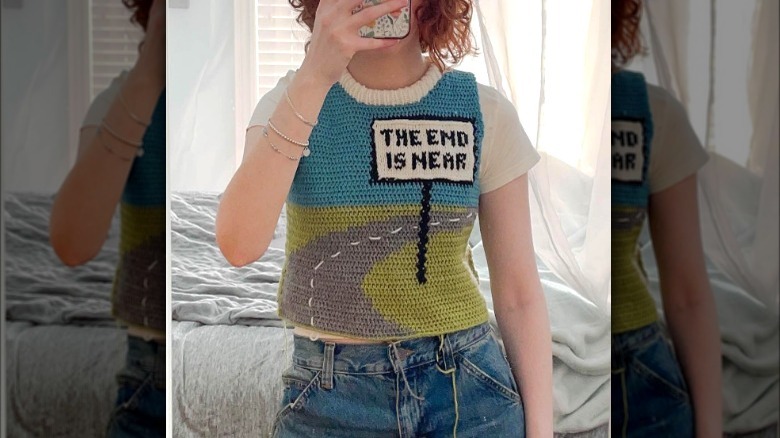 Girl wearing graphic crochet vest