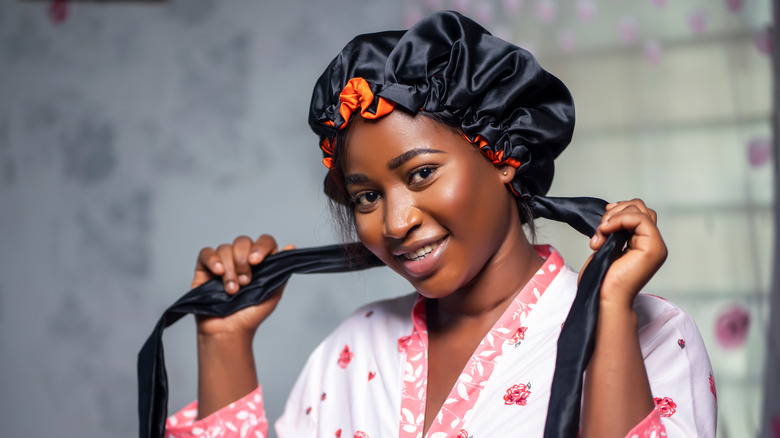 smiling woman with hair cap