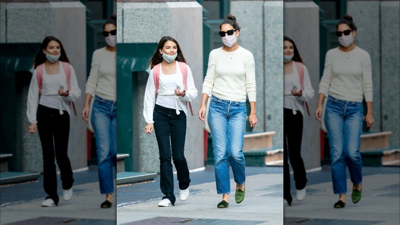 Suri Cruise outdoors with Katie Holmes