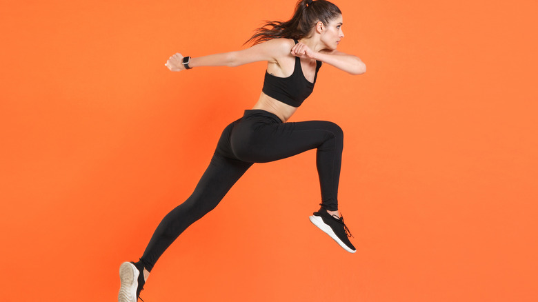 side profile of woman in running stance