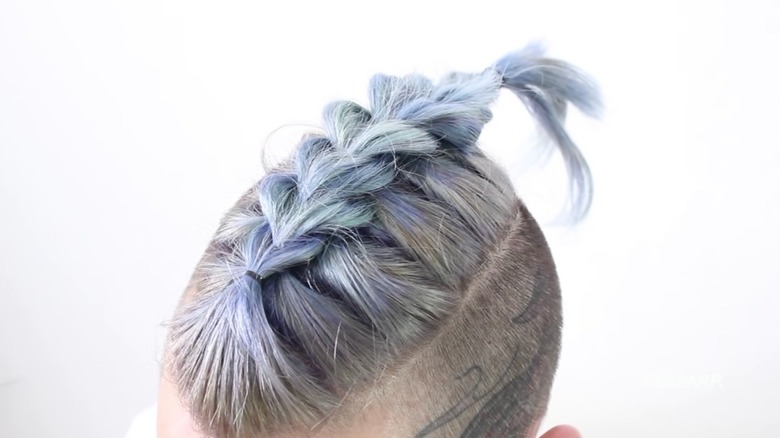 person with dragon braid in hair