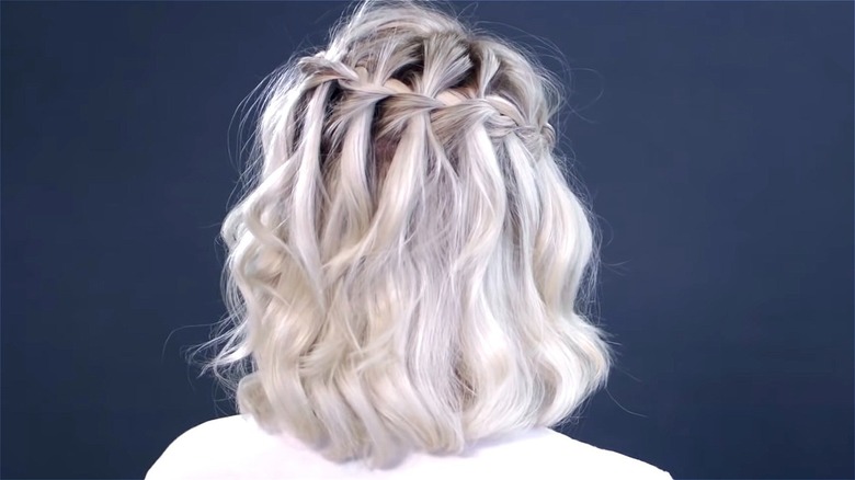 woman wearing single waterfall braid