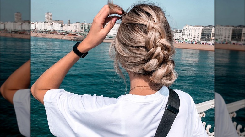 woman with single short chunky braid