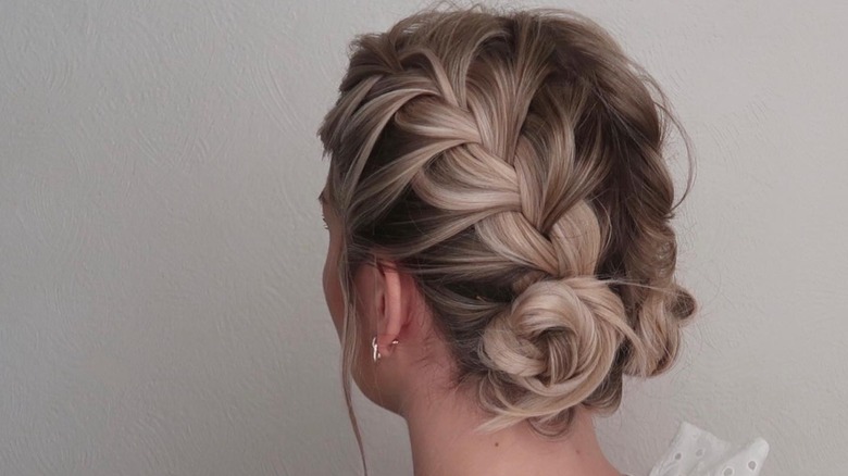 woman wearing hair in braided bun