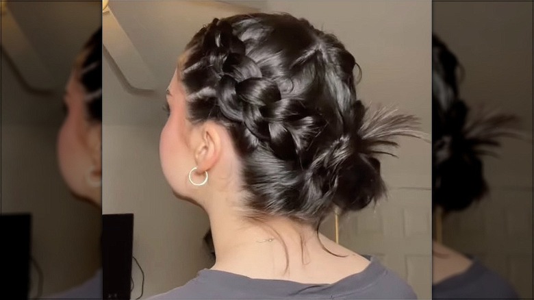 woman with dutch braid low bun