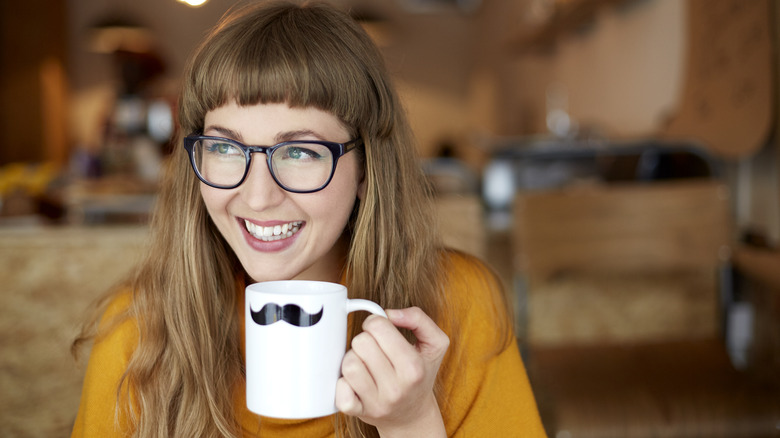 Woman black glasses mustache mug