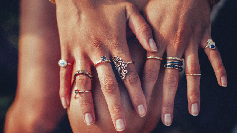 woman wearing multiple rings