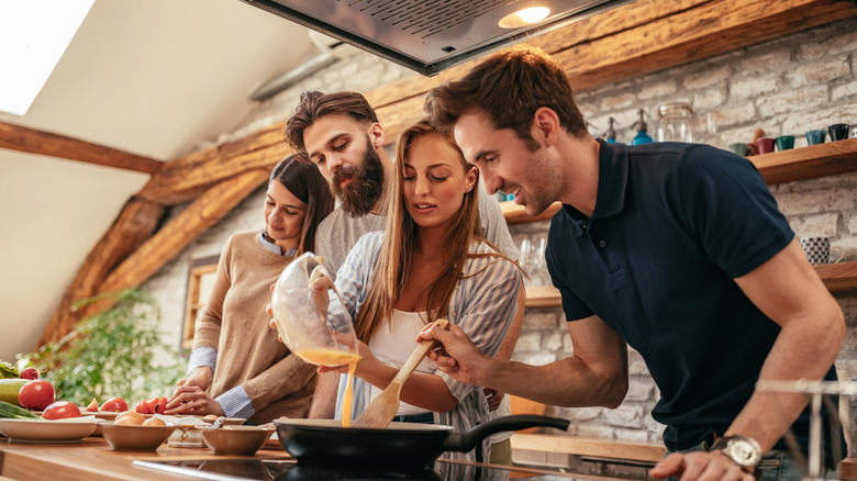 Friends cooking together