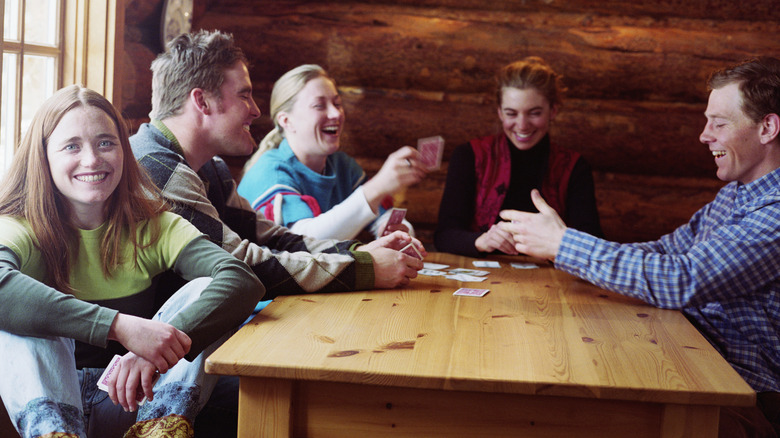 group of people playing cards