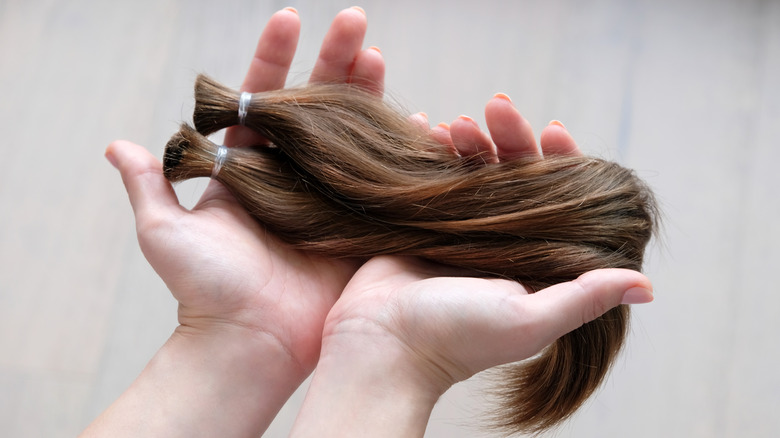 woman holding hair in hands