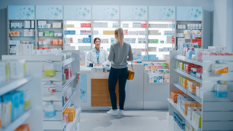 woman at the pharmacy with pharmacist