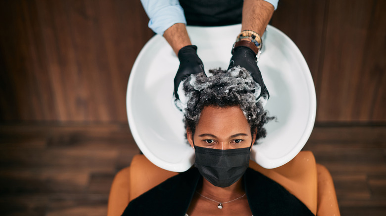 woman getting hair washed