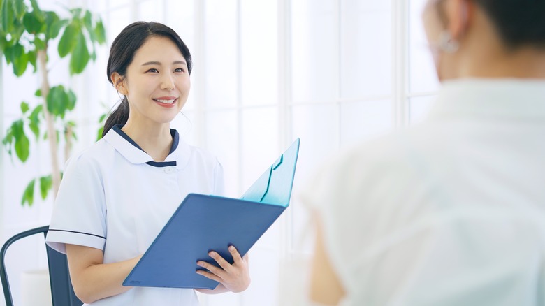 salon worker greeting client