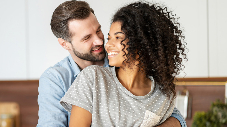 man and woman embracing