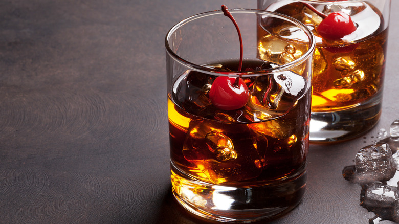 whiskey cocktail with maraschino cherries