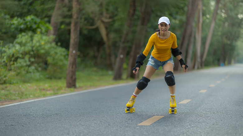 asian woman roller skating outside