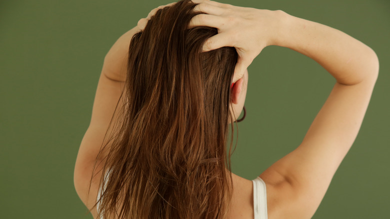 woman massaging her scalp