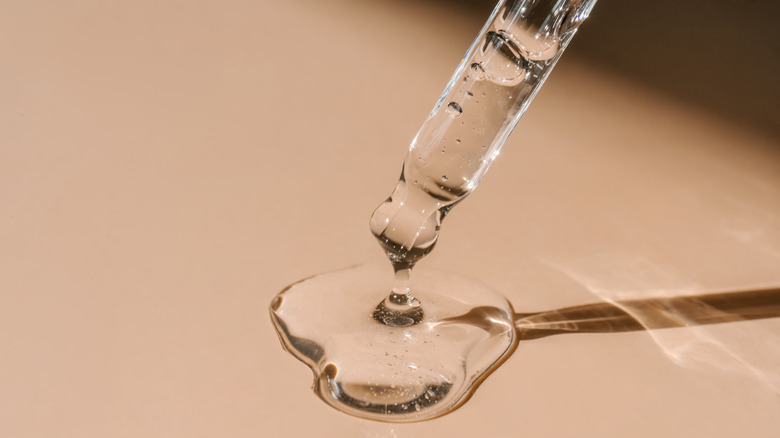 a serum coming out of a pipette