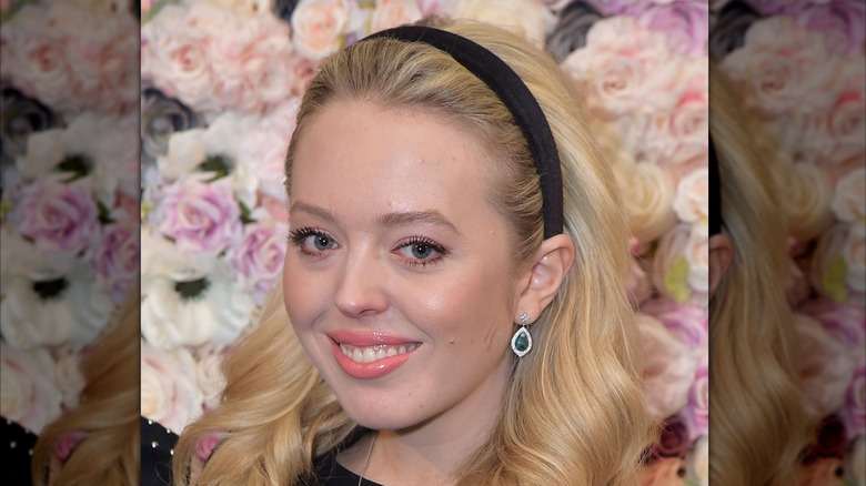 Tiffany Trump wearing a black headband and peach lipstick