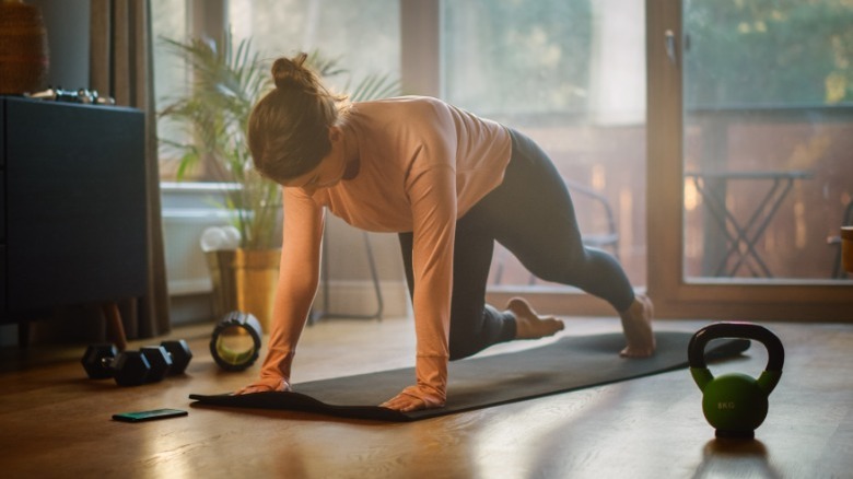 Woman doing mountain climber stretch