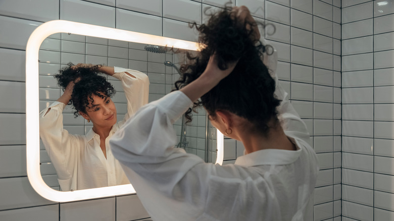 woman pulling back hair