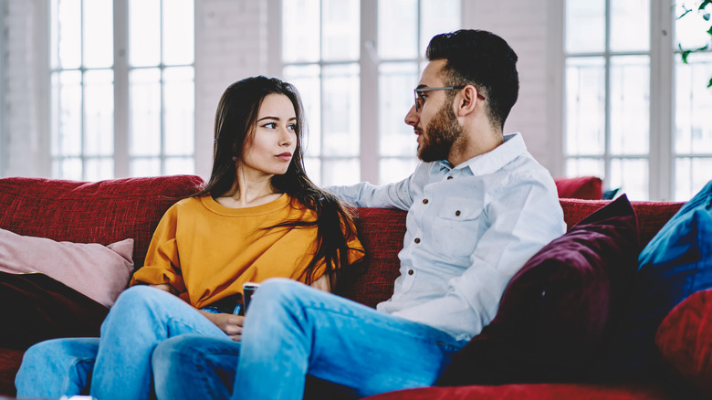 Couple on couch talking