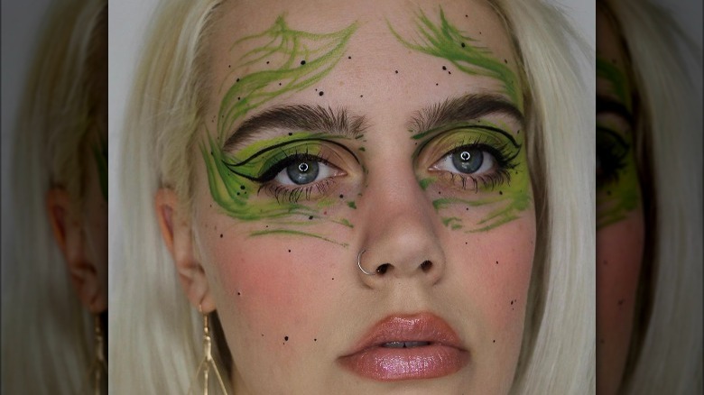 woman with green eye makeup