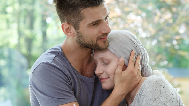 woman visiting man at hospital