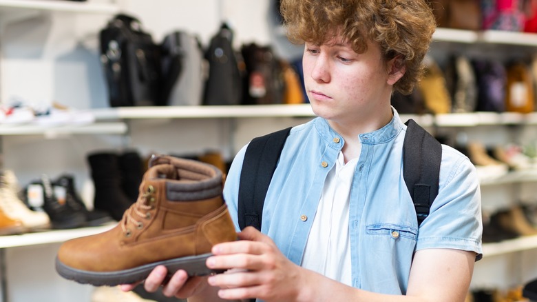 young man shopping shoes