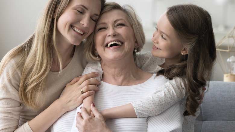 Three people hugging