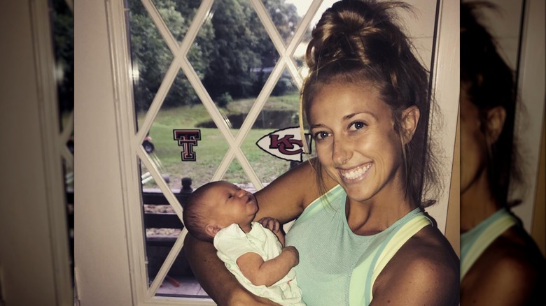 young Brittany Mahomes holding baby