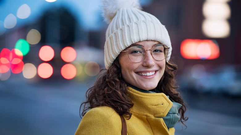 Woman smiling wearing hat