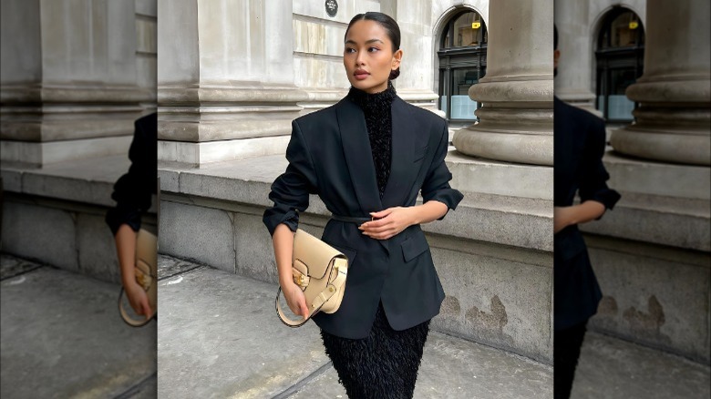 woman wearing a belted suit