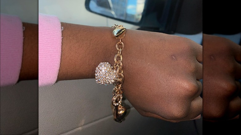 heart charm bracelet on a wrist