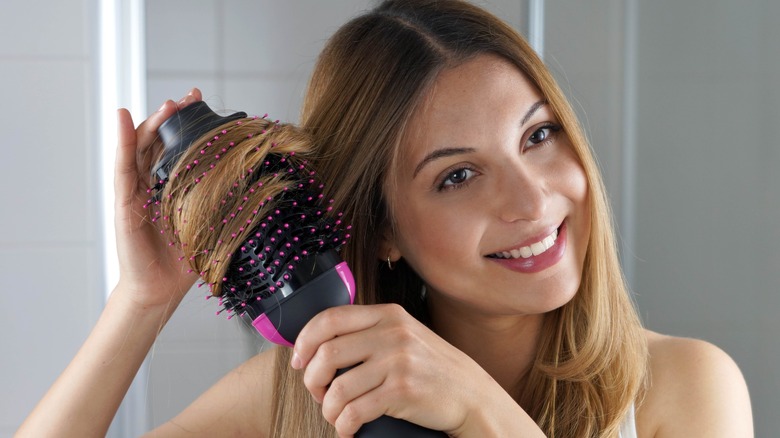 woman curling her hair