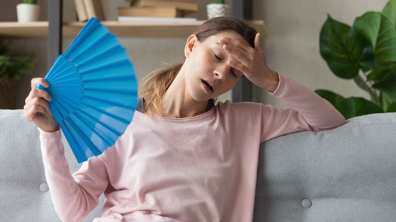 woman using a fan