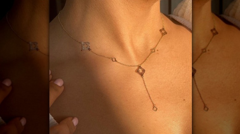 Dainty necklace on neck