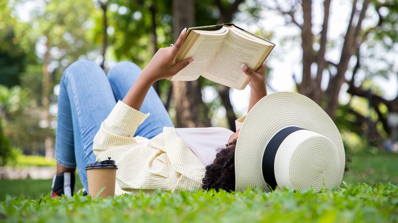 Woman reading on grass